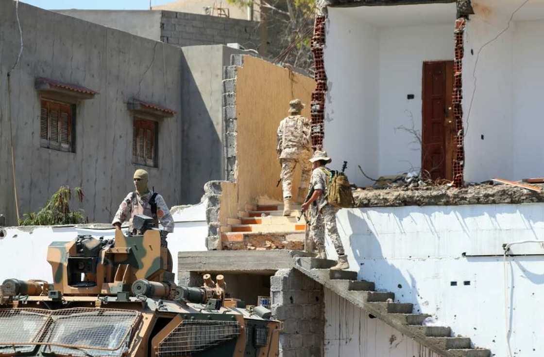 Members of 444 Brigade take up positions after fighting between two militias nominally loyal to Abdulhamid Dbeibah's Government of National Unity Members of 444 Brigade take up positions after fighting between two militias nominally loyal to Abdulhamid Dbeibah's Government of National Unity
