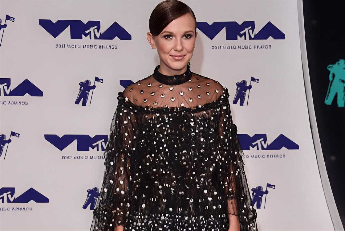 Millie Bobby Brown poses on the red carpet of the MTV Awards
