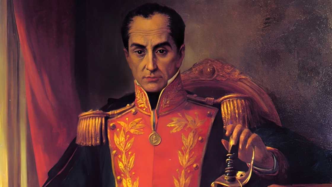 A portrait of Simón Bolívar as he sits on a throne-like seat in a general's uniform. A portrait of Simón Bolívar as he sits on a throne-like seat in a general's uniform.
