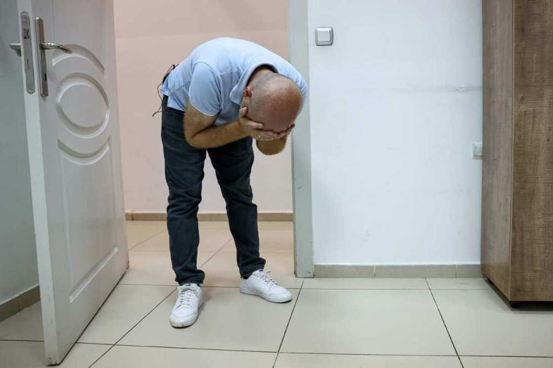 Qais Murad, 36-year-old former inmate at Sednaya prison, re-enacts an episode from his prison treatment