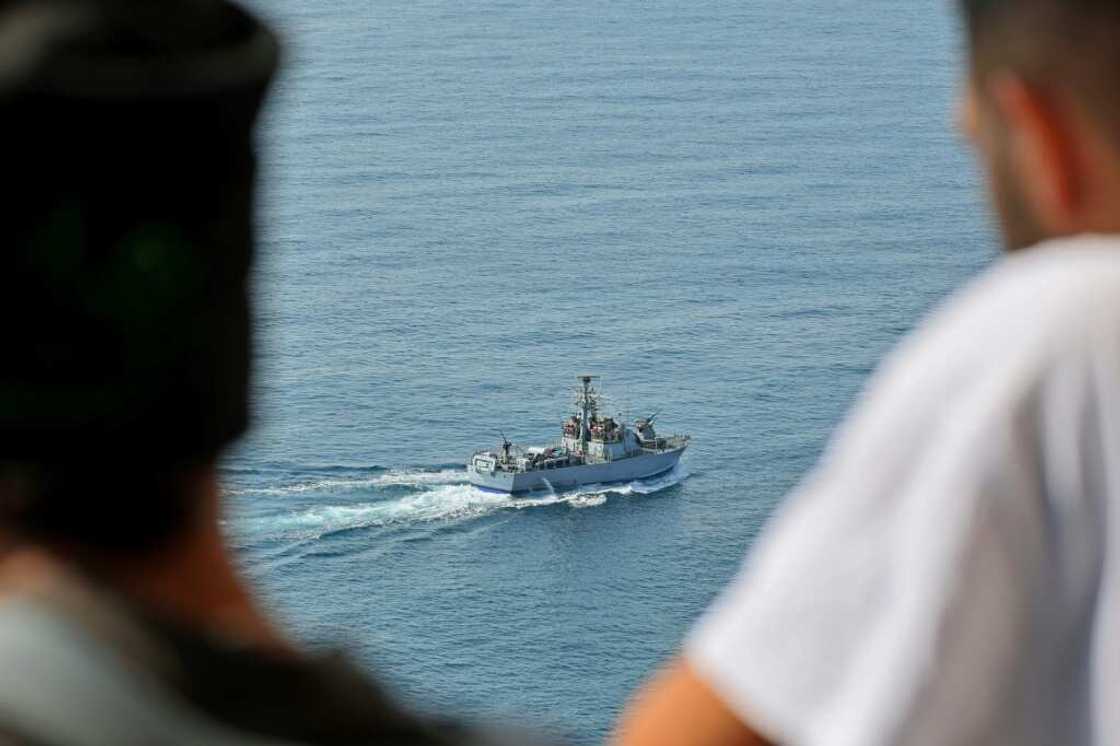 People watch as an Israeli navy fast patrol boat sails in the Mediterranean sea off Rosh HaNikra in northern Israel, close to the border area with Lebanon, ahead of the planned signing of the maritime accord People watch as an Israeli navy fast patrol boat sails in the Mediterranean sea off Rosh HaNikra in northern Israel, close to the border area with Lebanon, ahead of the planned signing of the maritime accord