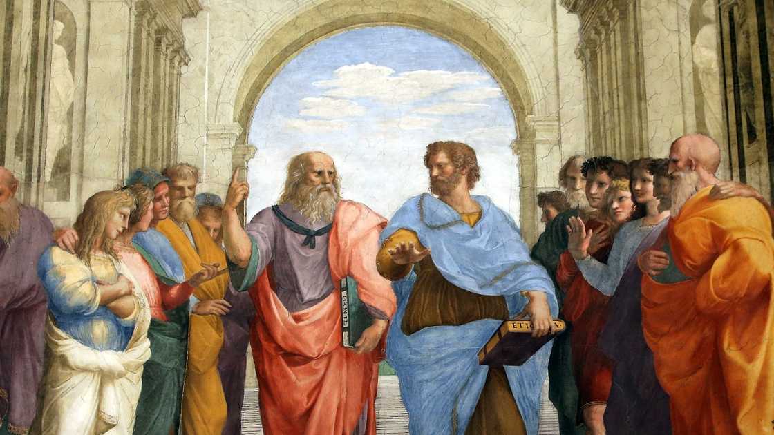 Artistic depiction of Plato in a red robe at the School of Athens.