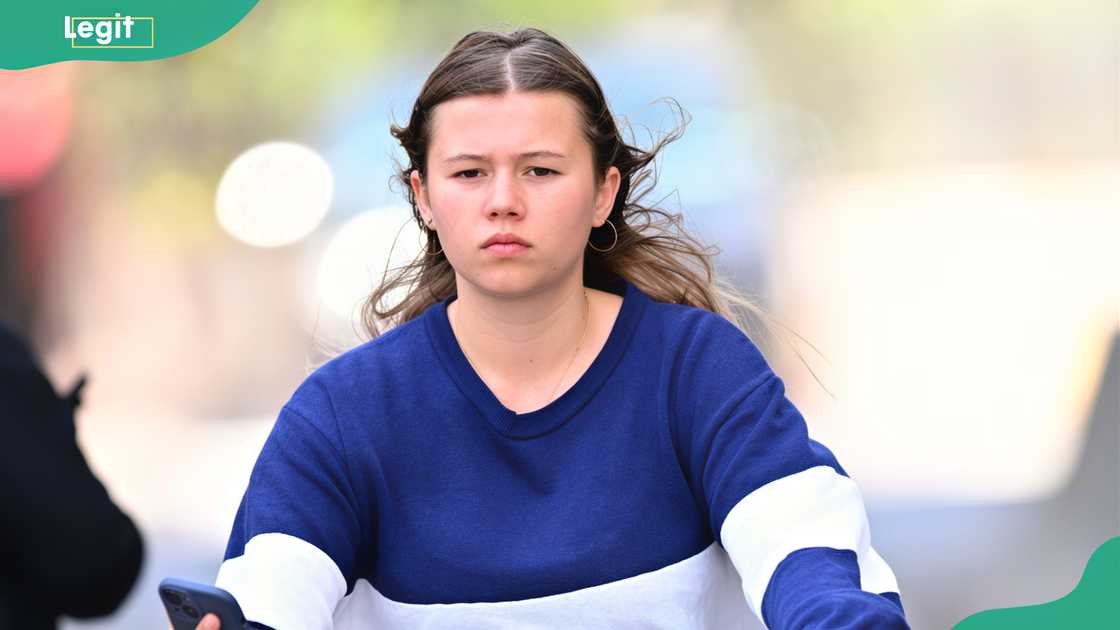 Michelle Williams' daughter, Matilda, cycling through the streets