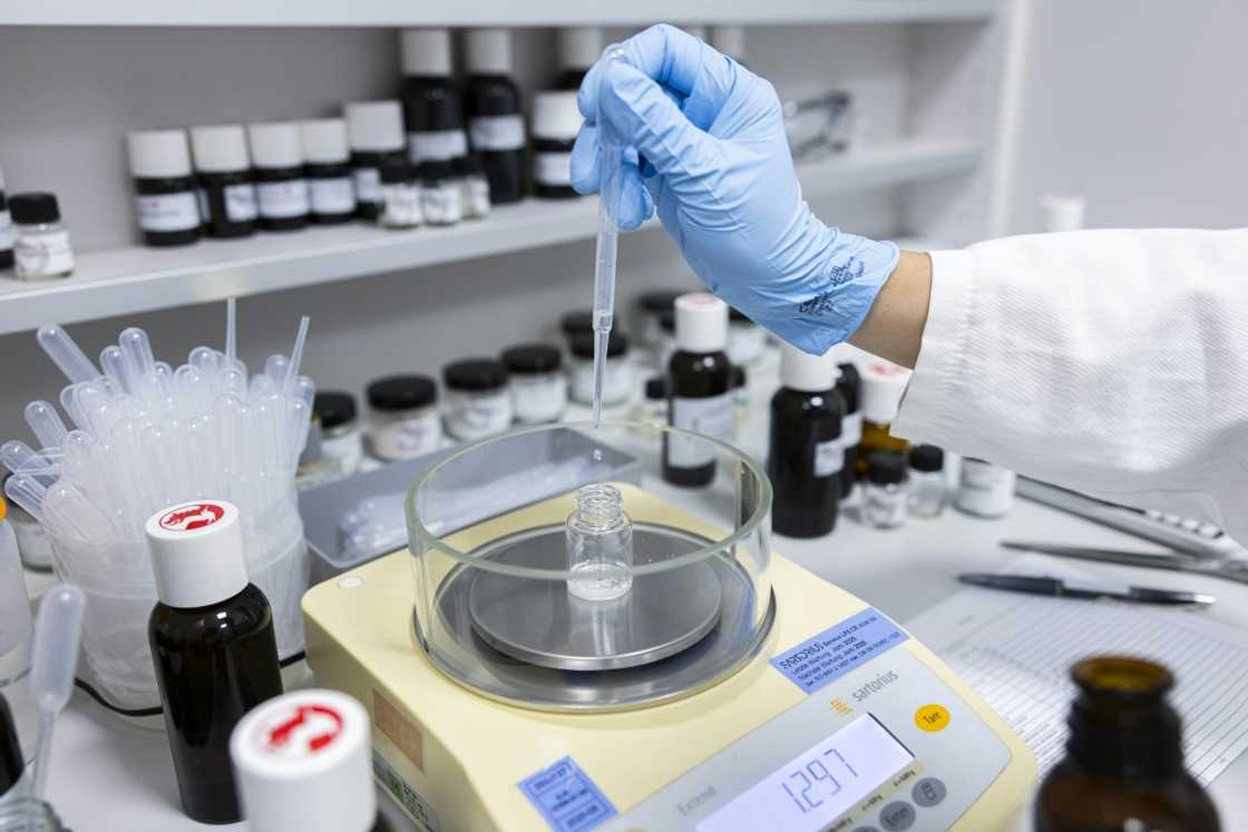 A perfume oil formula is produced in a mixing room at the Symrise company A perfume oil formula is produced in a mixing room at the Symrise company