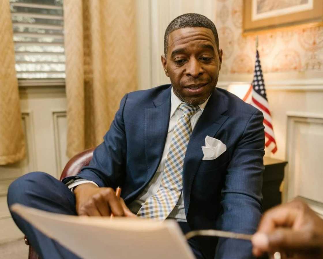 A man holding a thick document A man holding a thick document