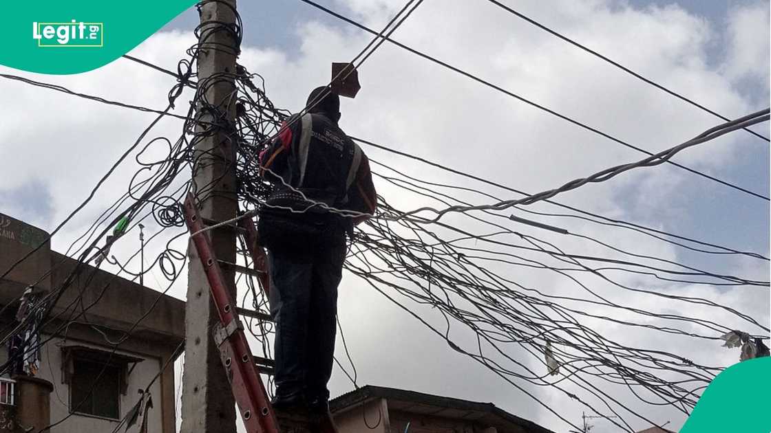 Man on an electricity pole Man on an electricity pole