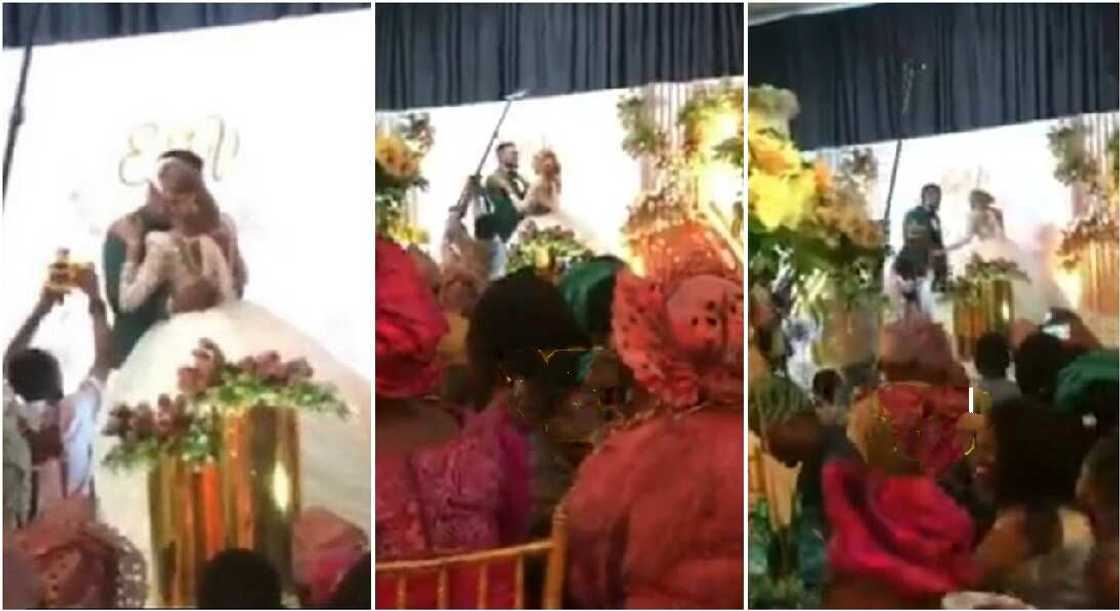Nigerian mum stops bride from kissing groom for too long at a wedding reception. Nigerian mum stops bride from kissing groom for too long at a wedding reception.