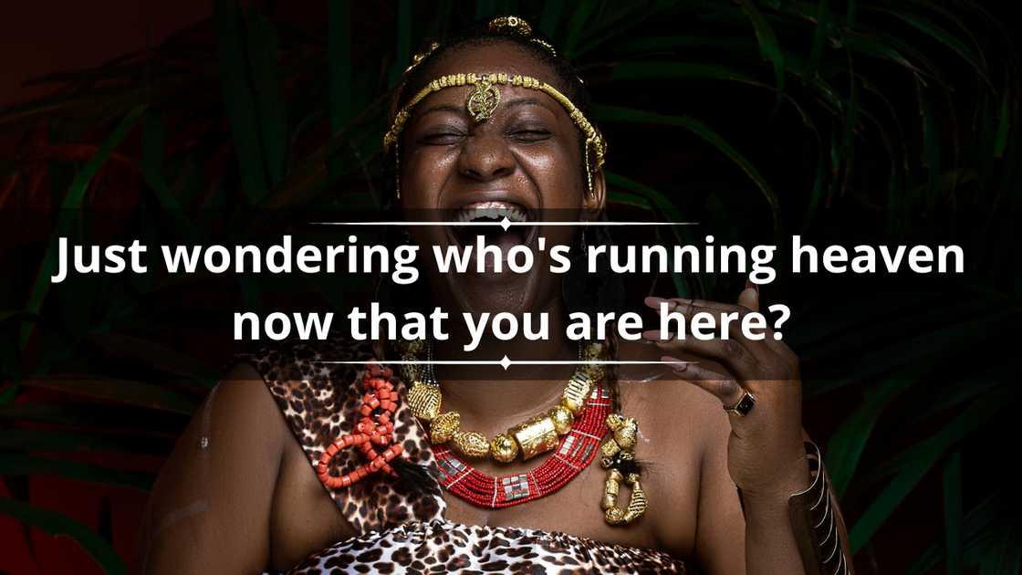 A woman in a leopard-print outfit is picture laughing A woman in a leopard-print outfit is picture laughing