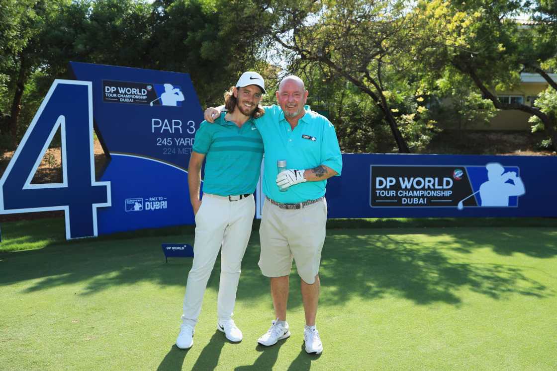 Tommy Fleetwood and his father pose for a picture during the DP World Tour Championship ProAm Tommy Fleetwood and his father pose for a picture during the DP World Tour Championship ProAm