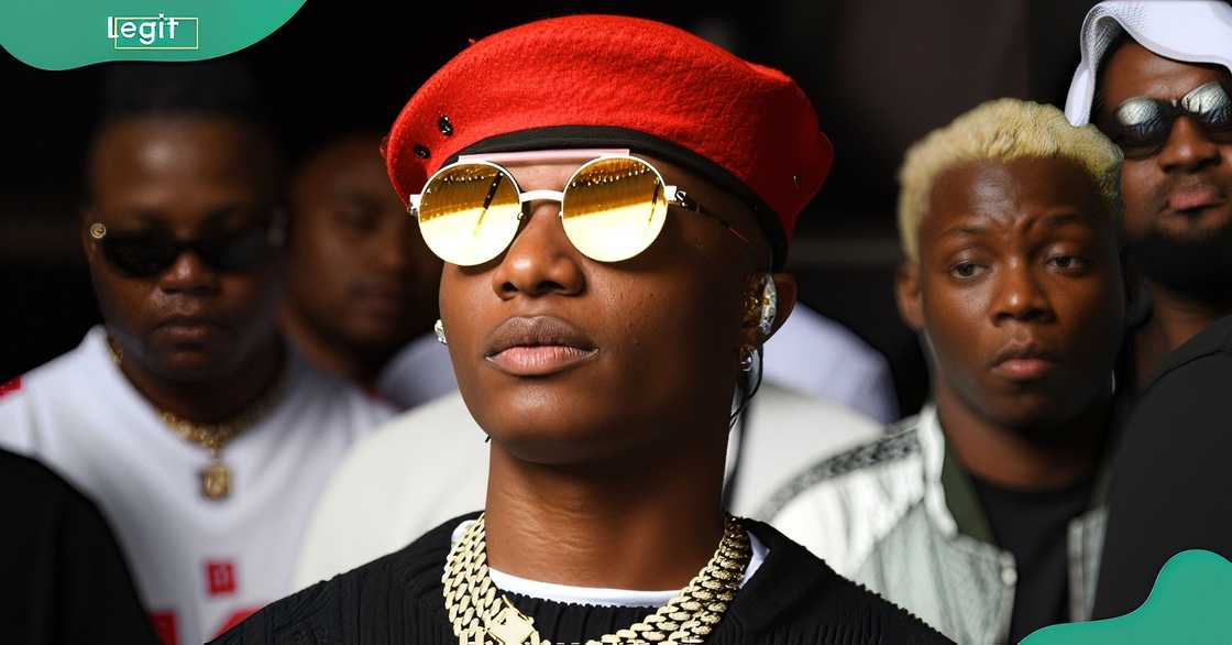 Wizkid wearing a red beret and gold chains Wizkid wearing a red beret and gold chains