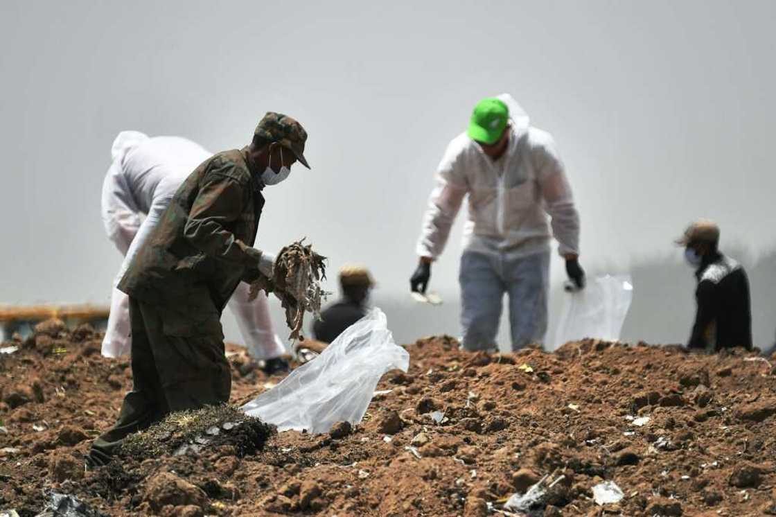Forensics experts shown in March 2019 combing through the crash site of an Ethiopian Airlines operated Boeing 737 MAX aircraft Forensics experts shown in March 2019 combing through the crash site of an Ethiopian Airlines operated Boeing 737 MAX aircraft
