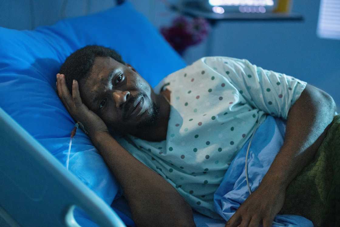 A worried man in a hospital bed A worried man in a hospital bed