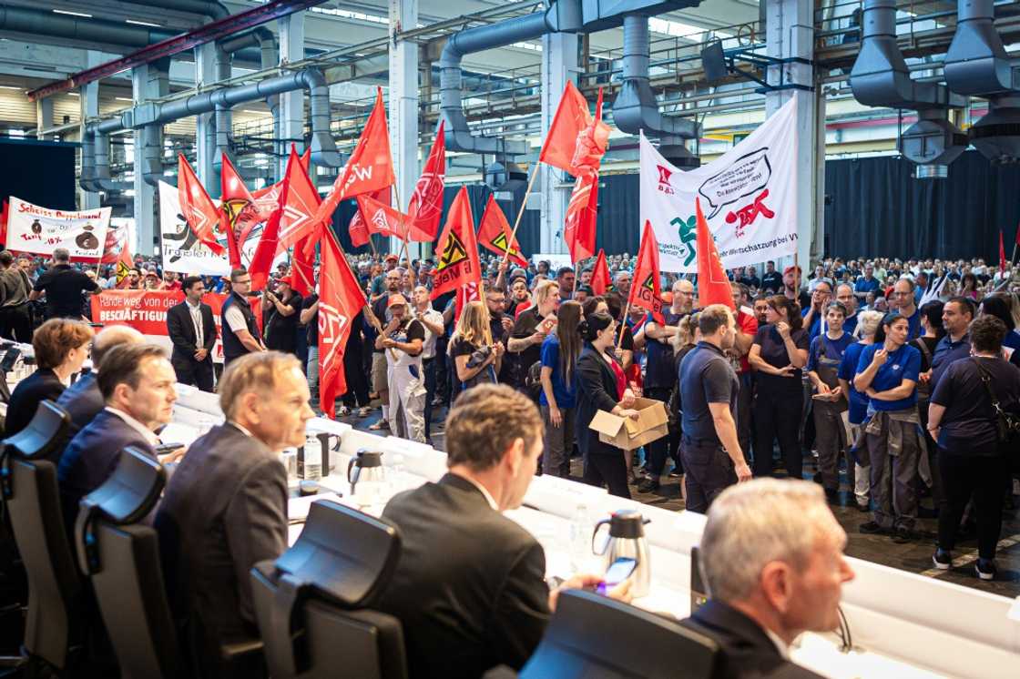 Volkswagen employees protested at the start of a automaker's general meeting last week after it said earlier in the week it could take the unprecedented step of closing production sites in Germany Volkswagen employees protested at the start of a automaker's general meeting last week after it said earlier in the week it could take the unprecedented step of closing production sites in Germany