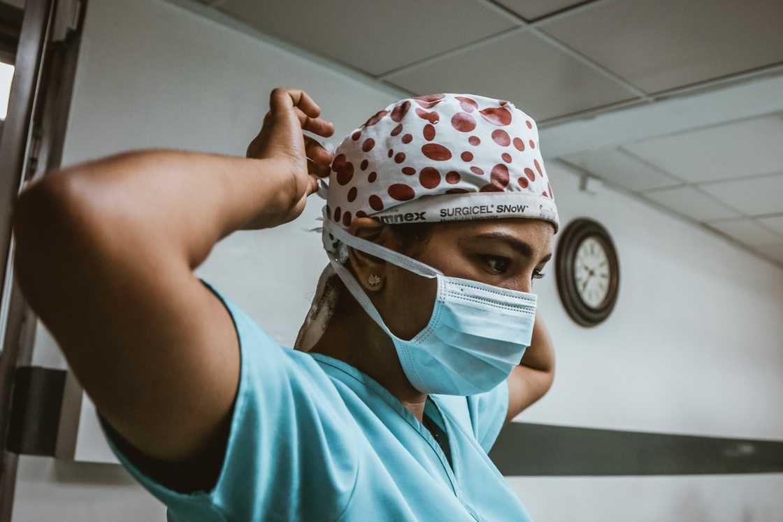 Nurse prepares for interacting with patients