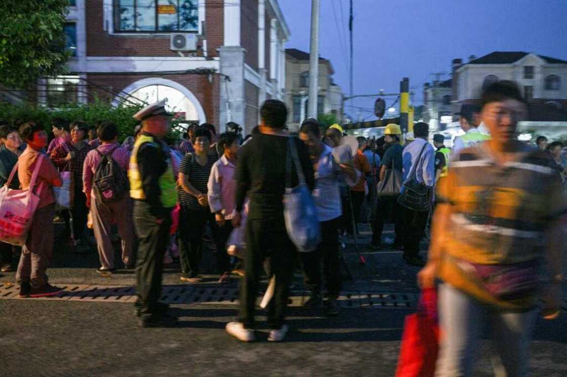 Day labourers seek dwindling jobs pre-dawn in Shanghai suburb