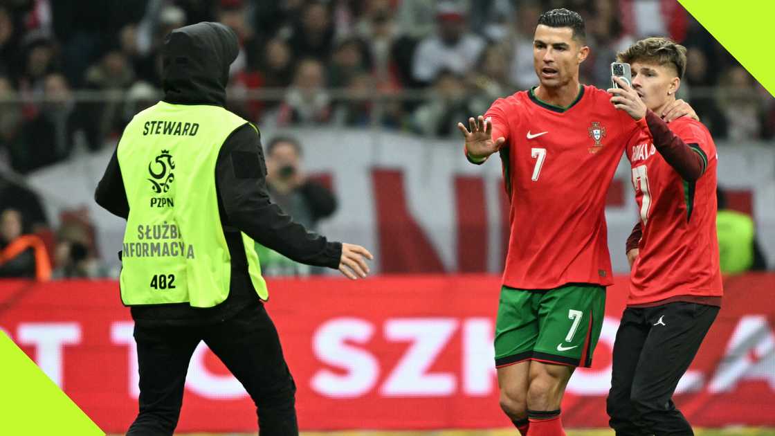 Al-Nassr talisman Cristiano Ronaldo pleads with steward to allow pitch invader to take a selfie with him during Portugal's Nations League clash with Poland on October 12, 2024. Al-Nassr talisman Cristiano Ronaldo pleads with steward to allow pitch invader to take a selfie with him during Portugal's Nations League clash with Poland on October 12, 2024.