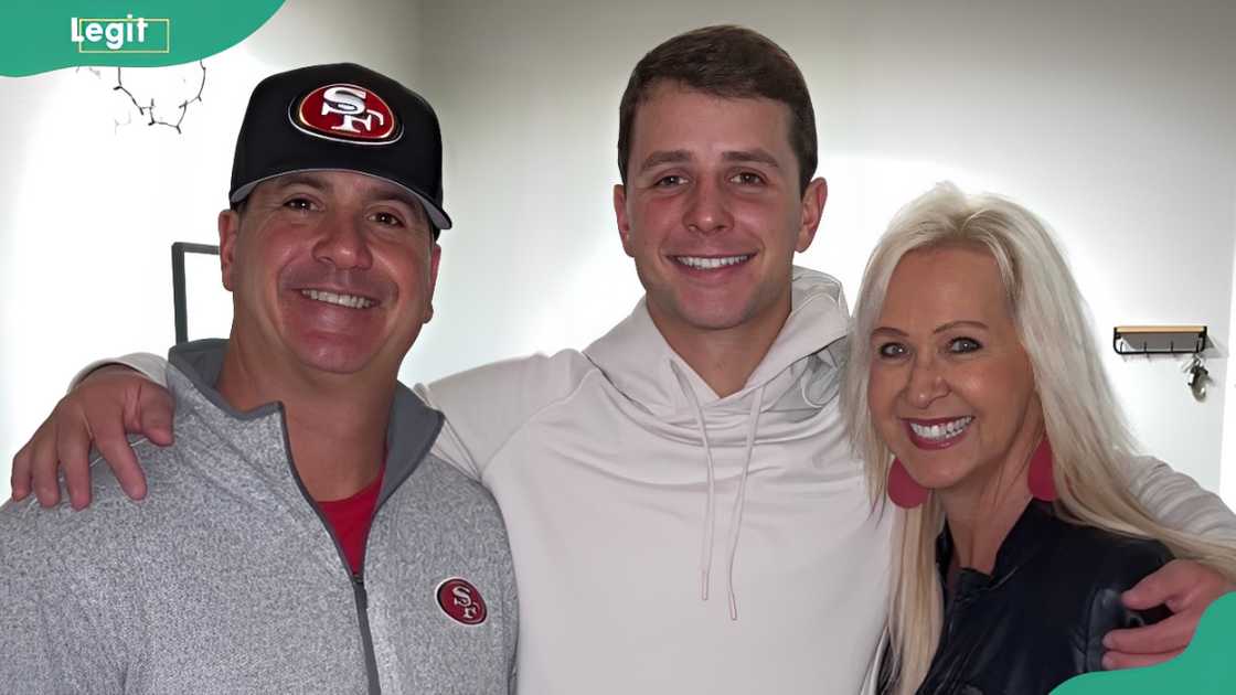 Brock Purdy embraces his parents before an NFL game