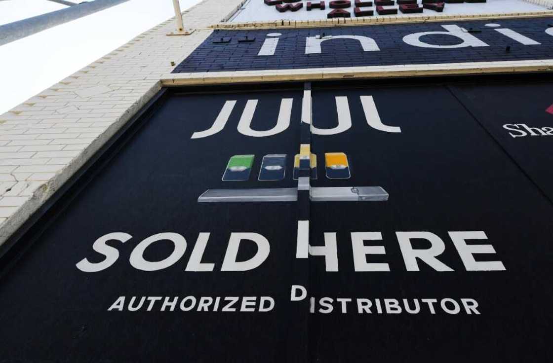 (FILES) In this file photo taken on September 17, 2019 a sign advertises Juul vaping products in Los Angeles, California (FILES) In this file photo taken on September 17, 2019 a sign advertises Juul vaping products in Los Angeles, California