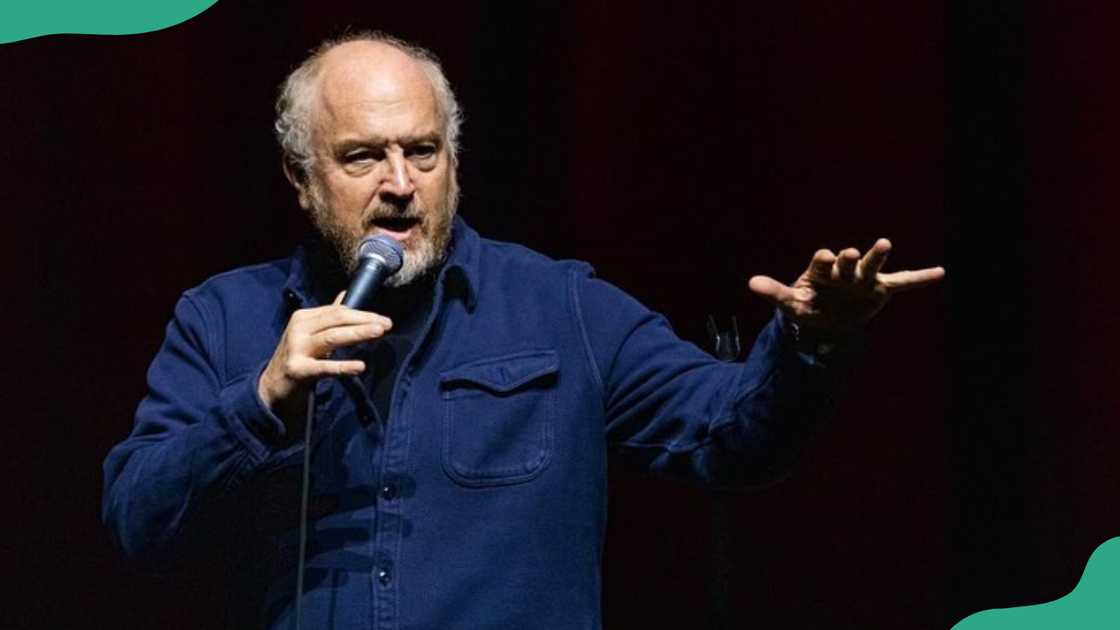 Louis C.K. performs stand-up comedy