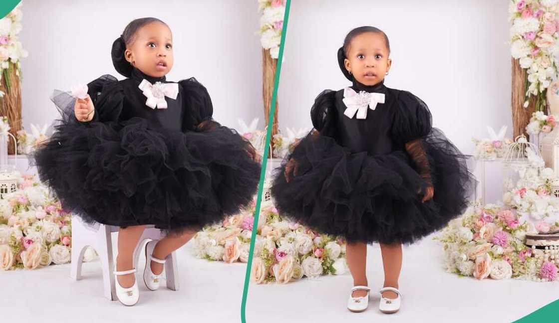 Little girl adorns cute black dress for her birthday Little girl adorns cute black dress for her birthday