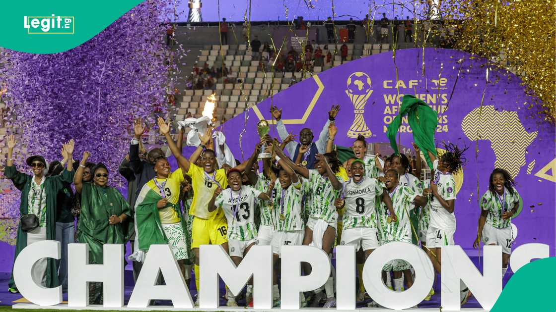Nigeria's players celebrate with the WAFCON trophy on the podium at Prince Moulay Abdellah Stadium in Rabat. Photo by Abdel BZIOUAT Nigeria's players celebrate with the WAFCON trophy on the podium at Prince Moulay Abdellah Stadium in Rabat. Photo by Abdel BZIOUAT