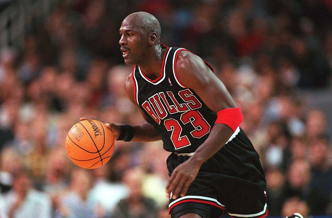 Michael Jordan of the Chicago Bulls dribbling the ball on the court