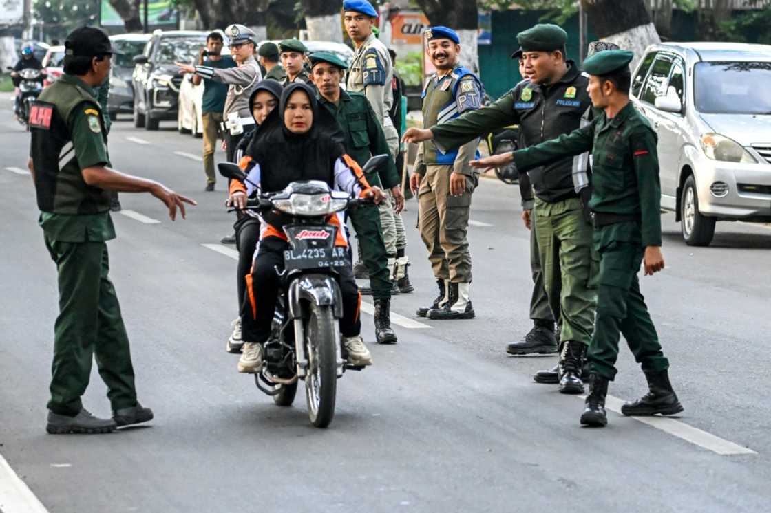 Aceh province catches attention for its conservative values that limit women's roles in society Aceh province catches attention for its conservative values that limit women's roles in society