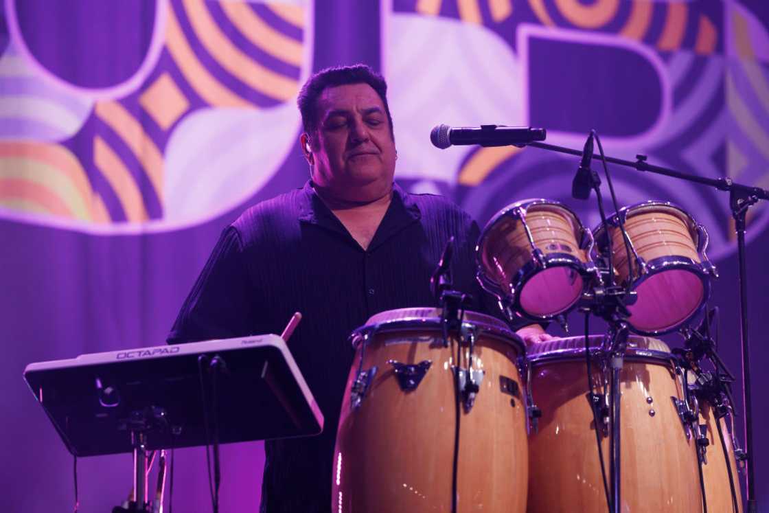 Norman Hassan plays drums at a concert in New Zealand Norman Hassan plays drums at a concert in New Zealand