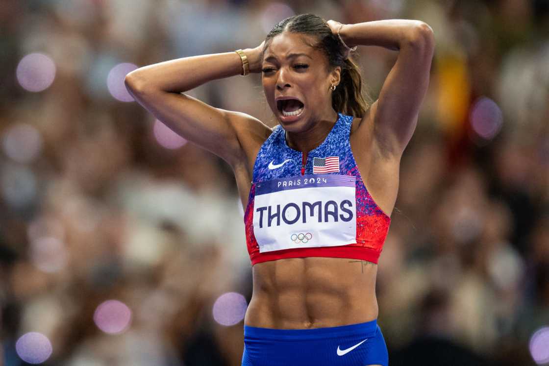 Gabby Thomas reacts after winning Olympic gold in the women's 200m.