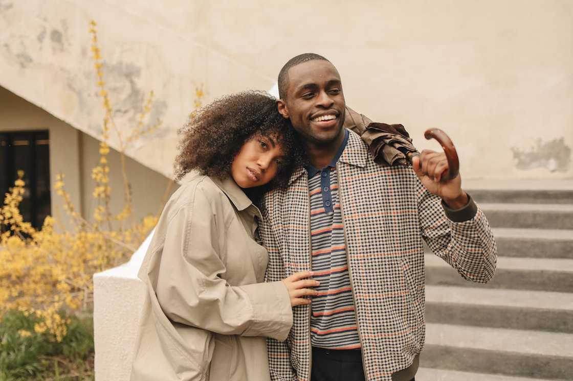 A couple walks together in public. A couple walks together in public.