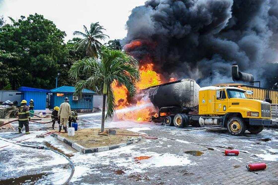 LASEMA officers putting out flames from a petrol tanker