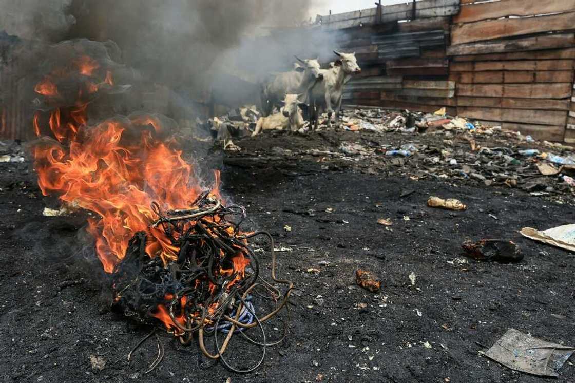 Unlicensed recycling in Yaounde -- electrical cables are burnt in a rubbish bin to recover copper, which is then sold Unlicensed recycling in Yaounde -- electrical cables are burnt in a rubbish bin to recover copper, which is then sold