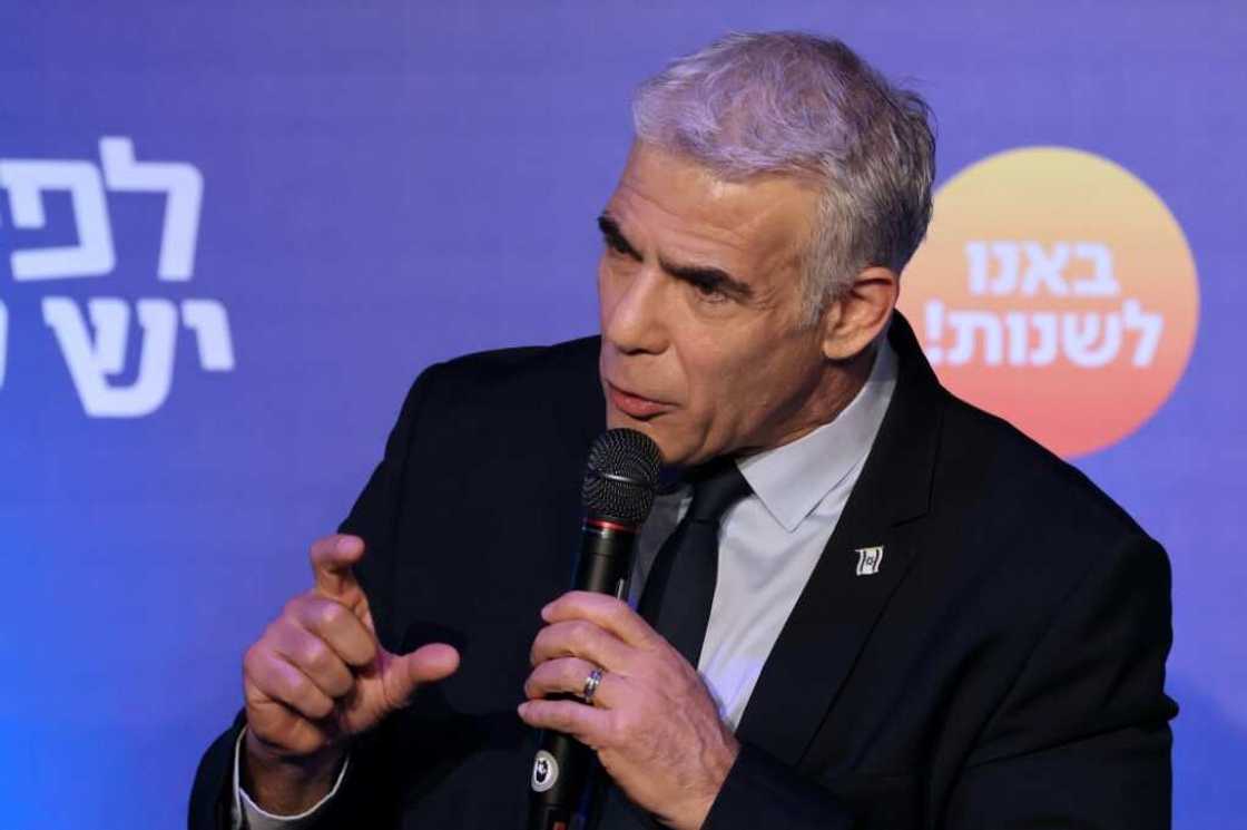 Israeli Prime Minister and head of the Yesh Atid party, Yair Lapid, speaks to supporters during a campaign rally in the northern city of Afek on October 24, 2022