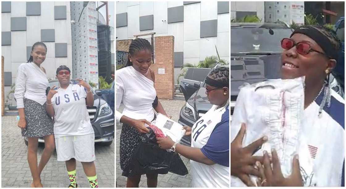 Nigerian lady poses with Teni who sang "I Want To Be Billionaire" as she receives gifts of shirts.