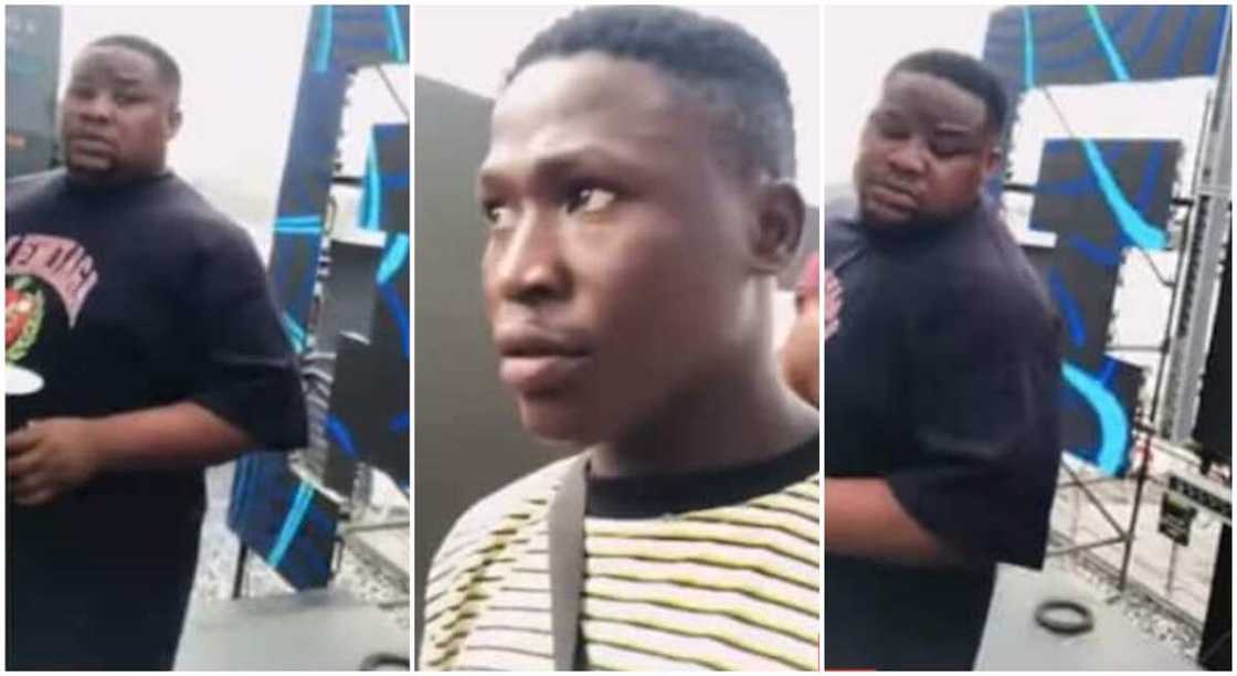 Photo of Cubana Chief Priest looking at a fan. Photo of Cubana Chief Priest looking at a fan.