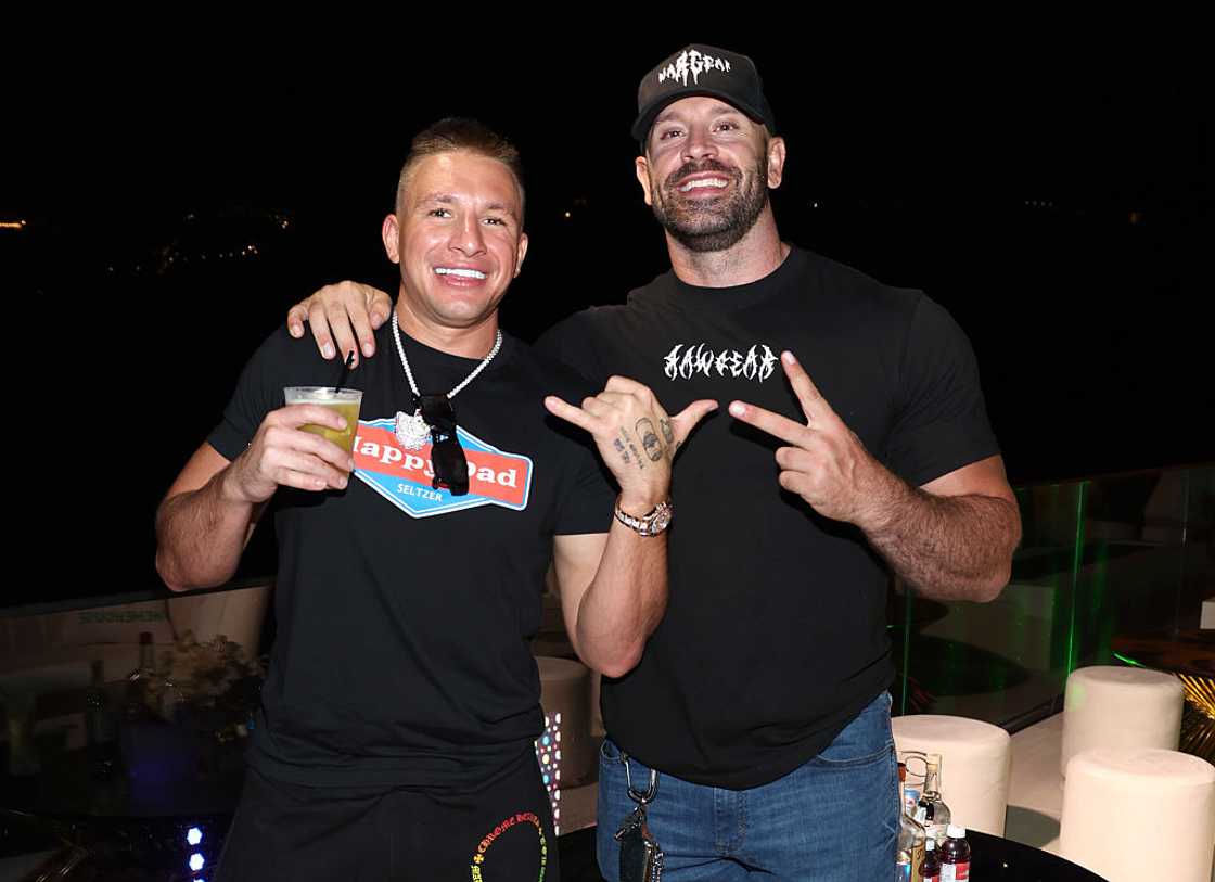Stephen "SteveWillDoIt" Deleonardis and Bradley Martin posing at the the Meme House White Party