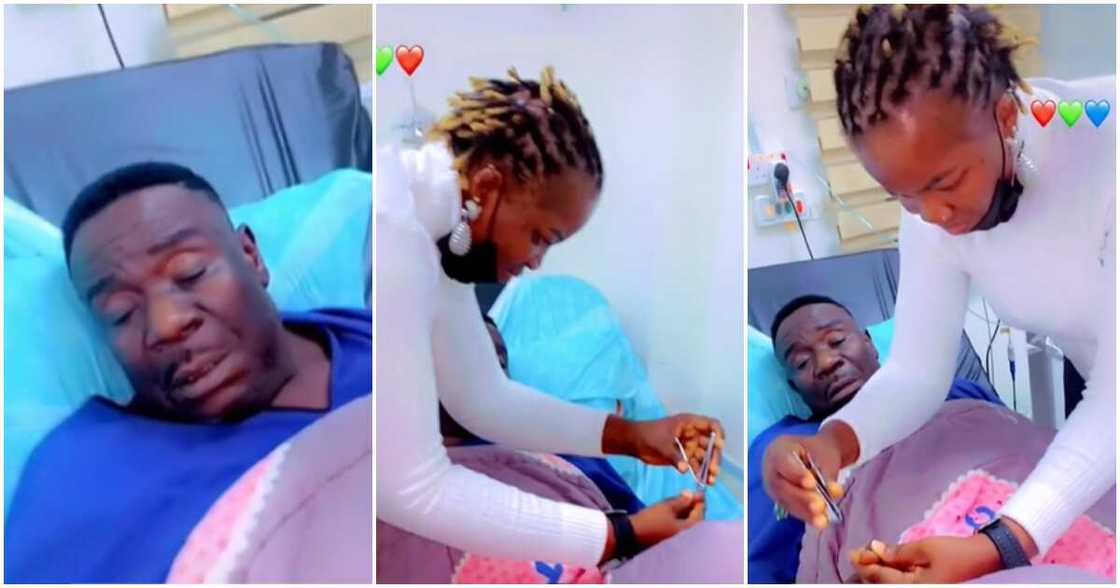 Mr Ibu's wife cutting his nails on sick bed Mr Ibu's wife cutting his nails on sick bed