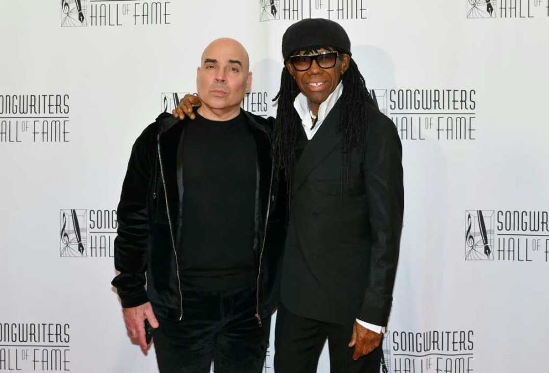 Hipgnosis executive Merck Mercuriadis (L) and co-founder Nile Rodgers attend the Songwriters Hall of Fame 2024 induction and awards gala in New York on June 13, 2024 Hipgnosis executive Merck Mercuriadis (L) and co-founder Nile Rodgers attend the Songwriters Hall of Fame 2024 induction and awards gala in New York on June 13, 2024