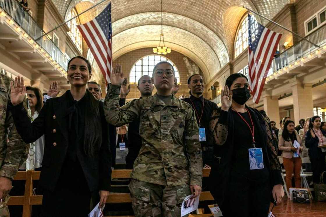 New US citizens take the oath during a naturalization service on Ellis Island, a highly symbolic spot for the ceremony New US citizens take the oath during a naturalization service on Ellis Island, a highly symbolic spot for the ceremony