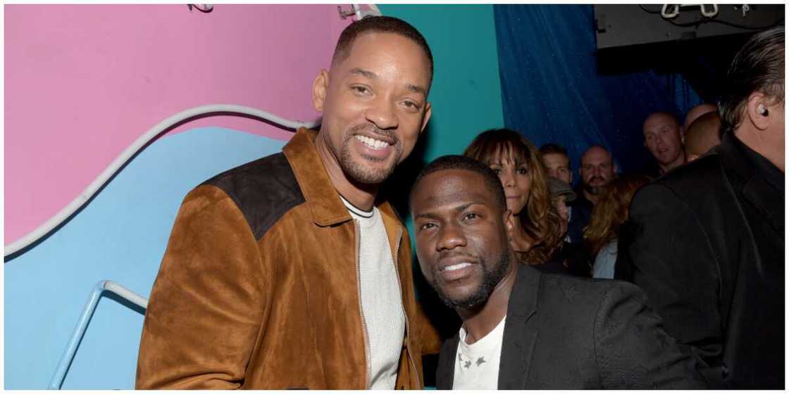 A photo of Will Smith and Kevin Hart at an event. A photo of Will Smith and Kevin Hart at an event.
