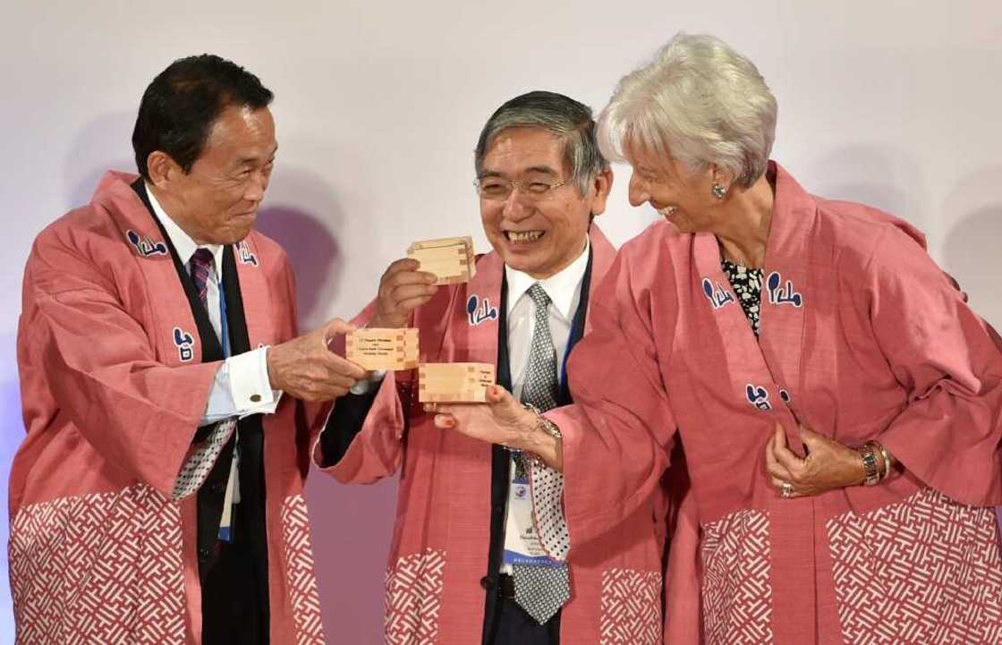 Outgoing Bank of Japan governor Haruhiko Kuroda (C) had both a strong network in Japan and an international profile Outgoing Bank of Japan governor Haruhiko Kuroda (C) had both a strong network in Japan and an international profile