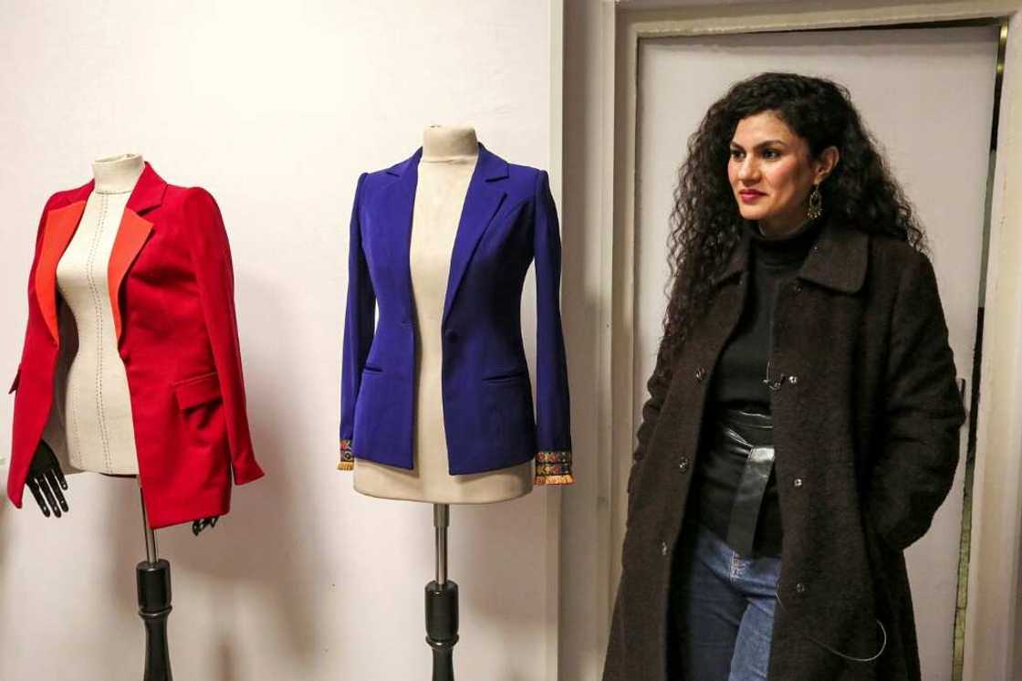 Alaa Adel, an Iraqi fashion designer, poses for a picture at her "Iraqcouture" studio in the capital Baghdad