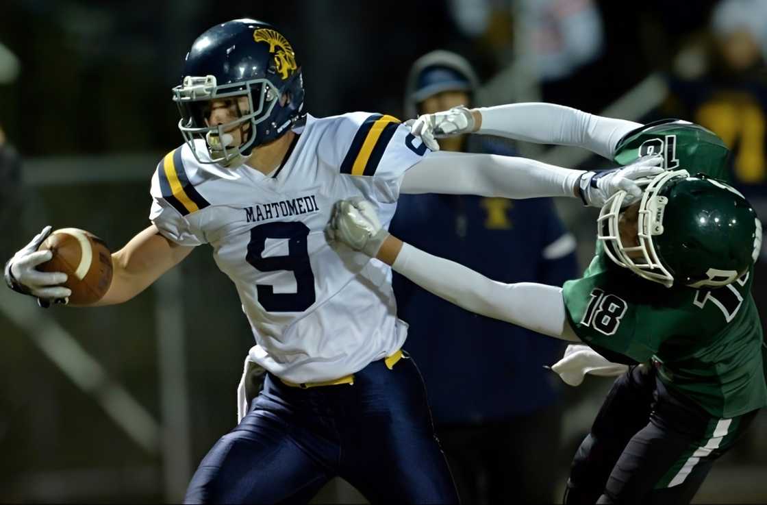 Andy Voyen escapes a tackle during a football match.