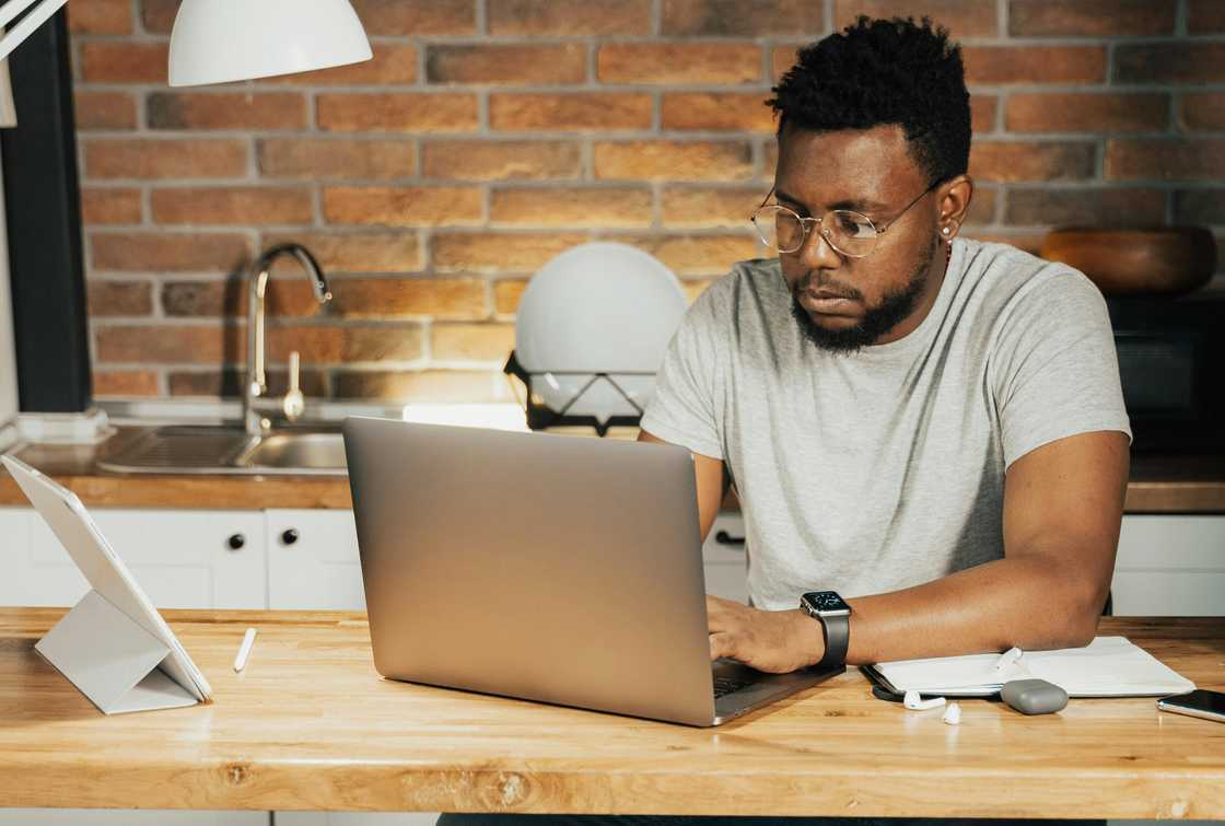 A man working on his laptop A man working on his laptop