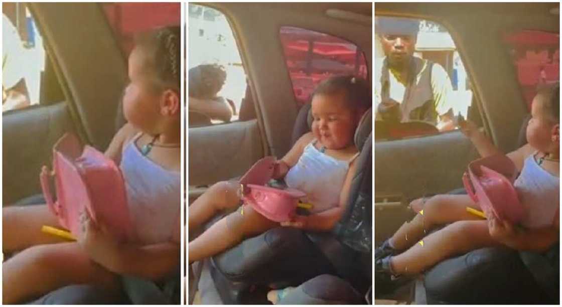 Beautiful baby girl sits in car like adult, offers cash to begger. Beautiful baby girl sits in car like adult, offers cash to begger.