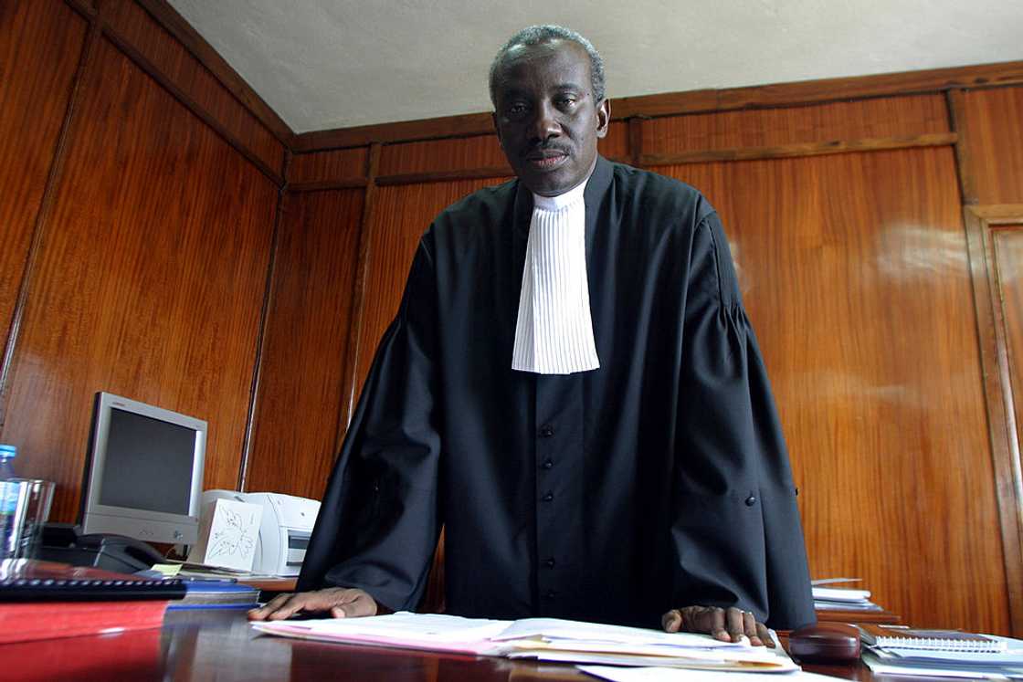 Lawyer gives letter to children of his late client.