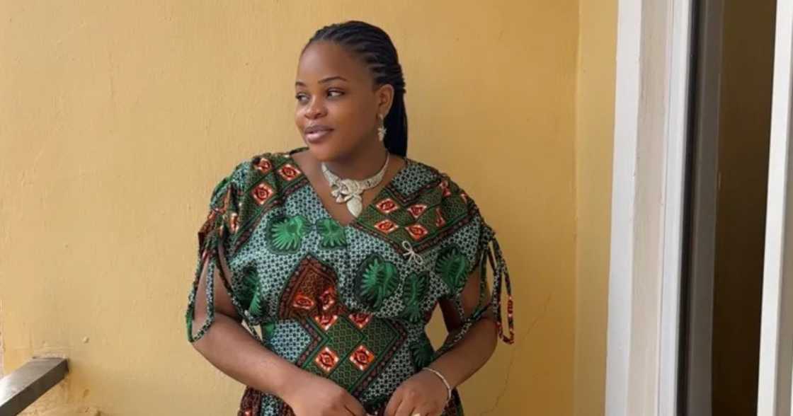 Lady displays the meat that she received from her husband as push gift.
