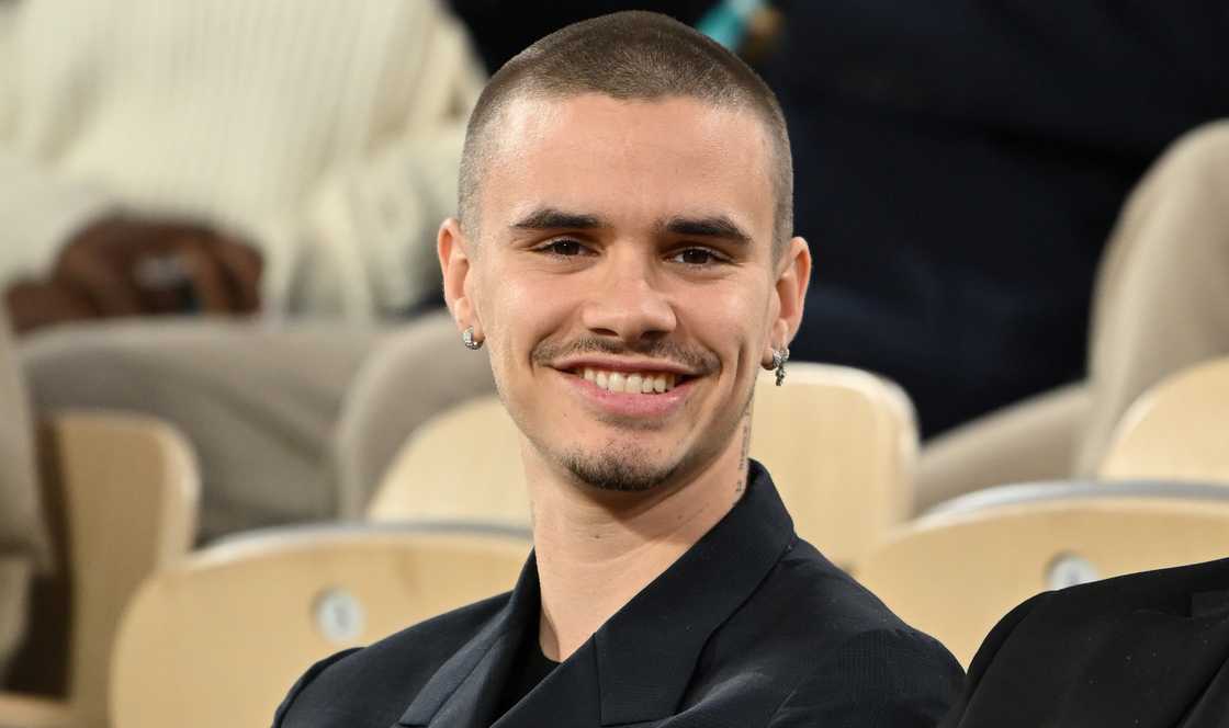 Romeo Beckham sits and reacts during the 2025 Roland Garros in Paris, France.