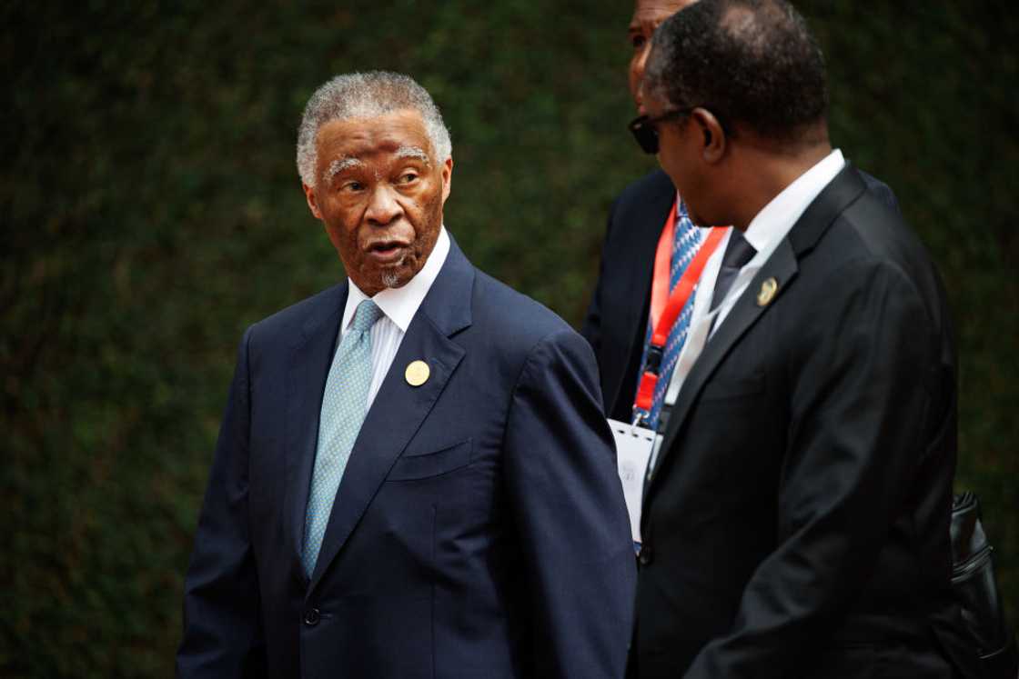 Thabo Mbeki arrives at a meeting in Rwanda