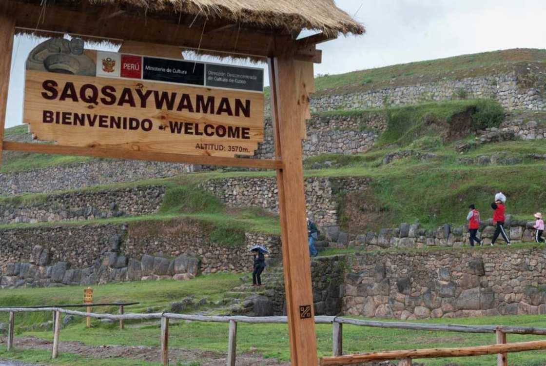 A handful of tourists visit the Sacsahuaman Inca ruins in Cusco, where 95 percent of hotel rooms have been cancelled due to the anti-government protests